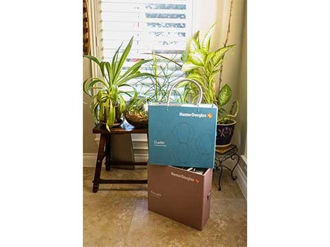 Two Hunter Douglas branded cases stacked